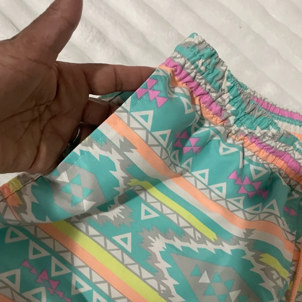 chubbies Turquoise Aztec Swim Trunks with Pink and Yellow Accents